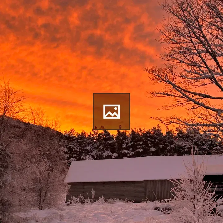 Winter landscape with sunrise glow