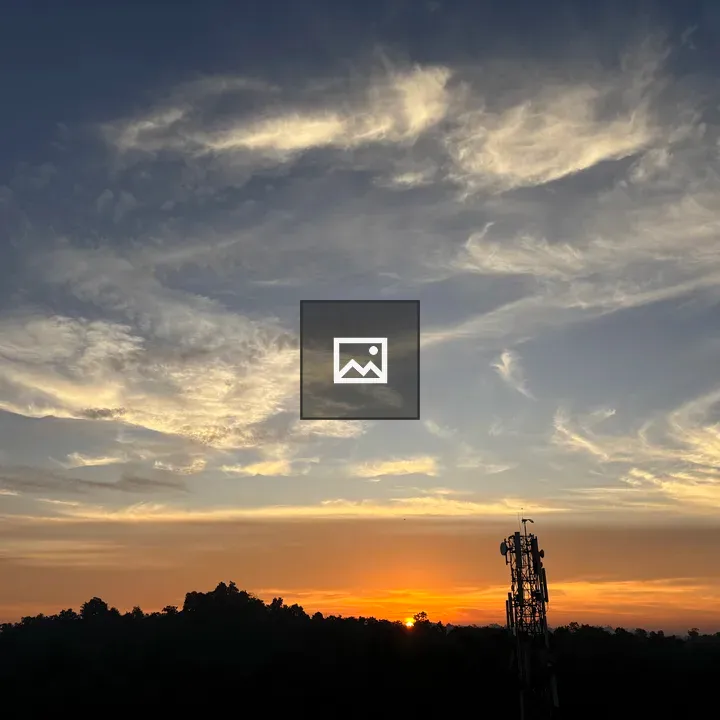 Sunrise Over Trees and Tower