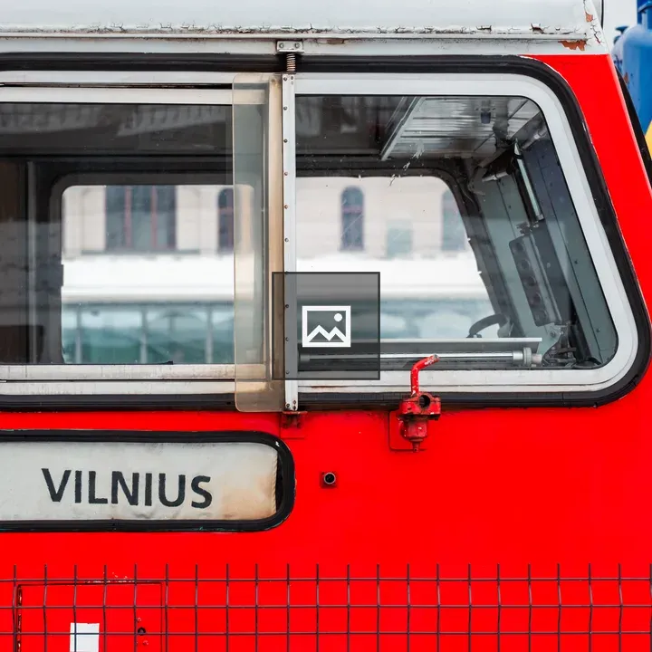 Vilnius train sign on old red locomotive