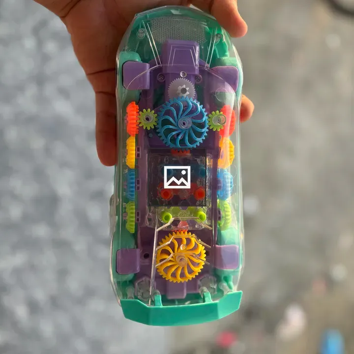 Colorful toy car in hand
