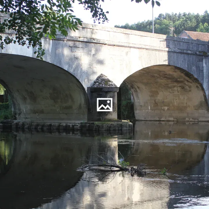 Historic stone bridge over river