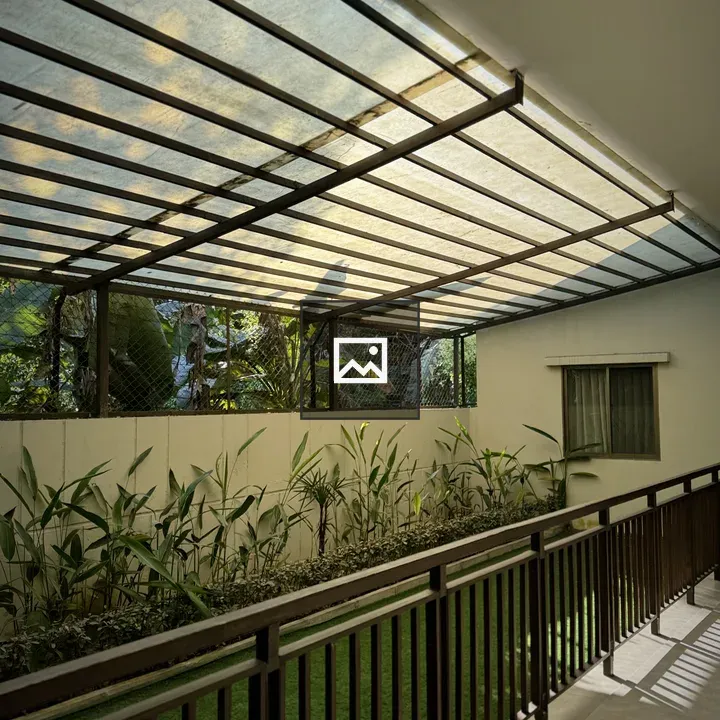 Outdoor Corridor with Green Lawn and Plants
