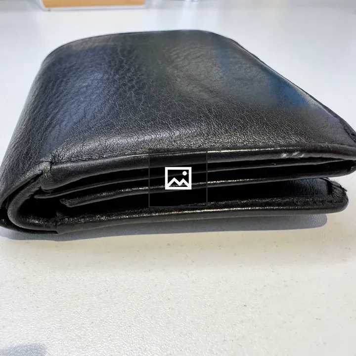 Black Leather Wallet on Surface