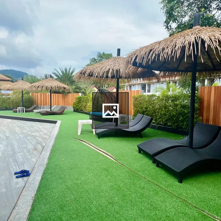 Poolside seating with thatched umbrellas
