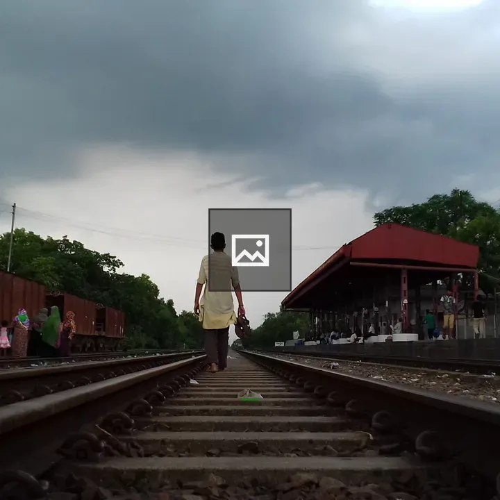 Boy with Shoes on Railway