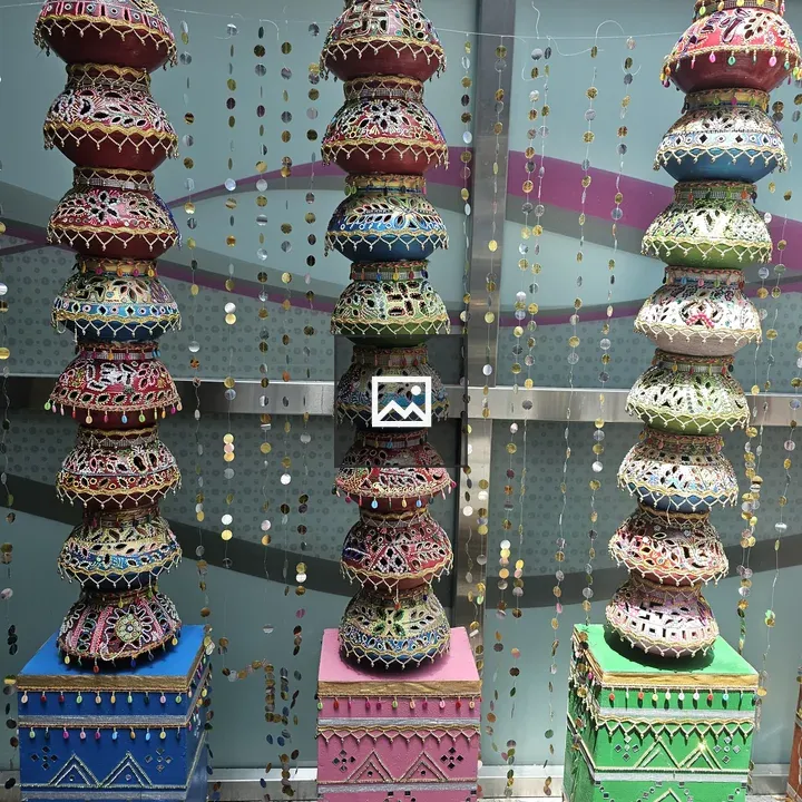 Colorful pots stacked tall