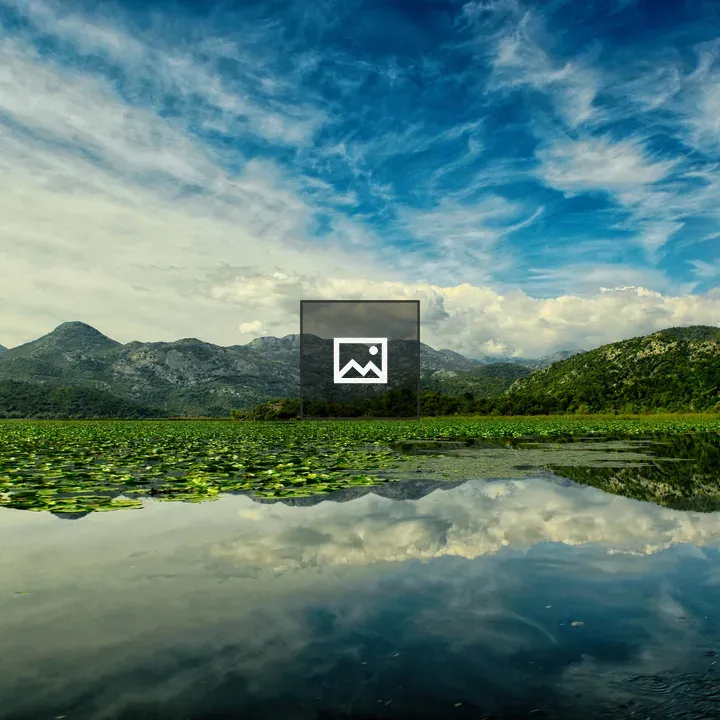 Lake with Water Lilies and Mountains