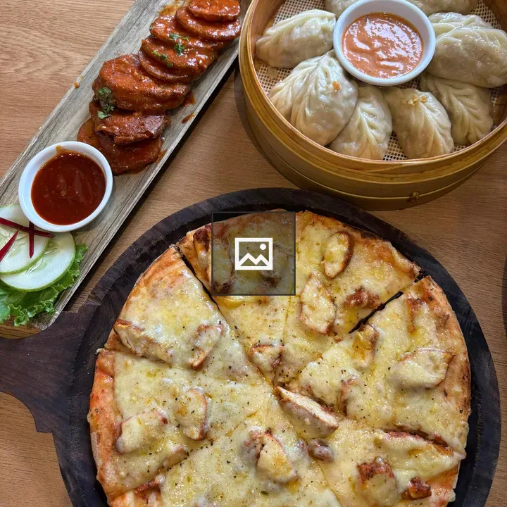 Dumplings and Pizza on Wooden Platter
