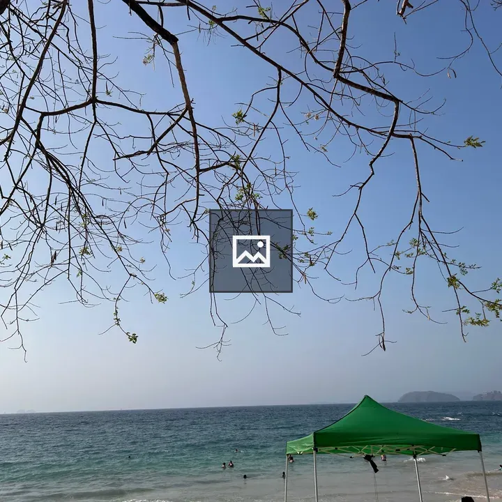 Beach scene with tents and swimmers