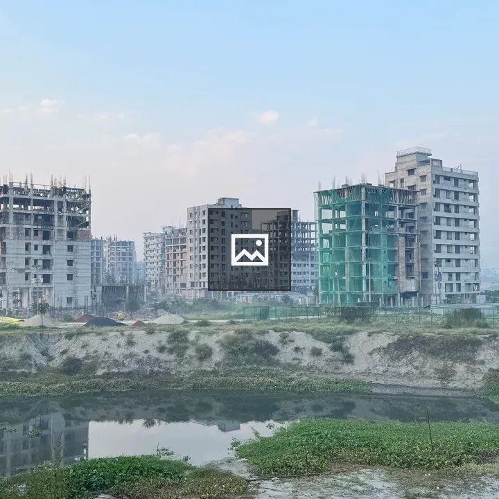 Tall concrete buildings under construction