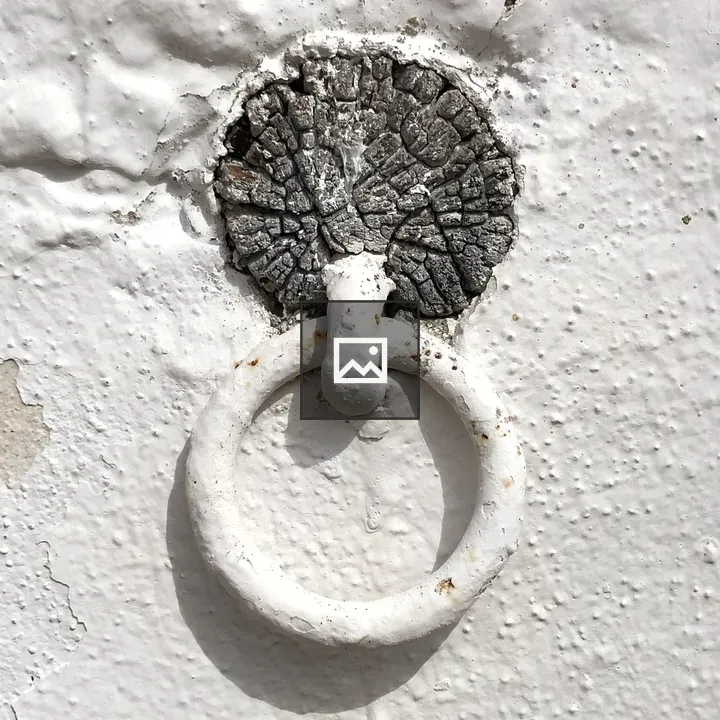White Ring on Weathered Wall