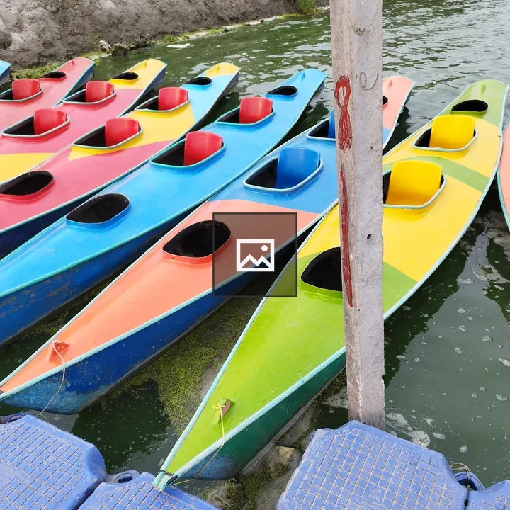 Row of colourful kayaks