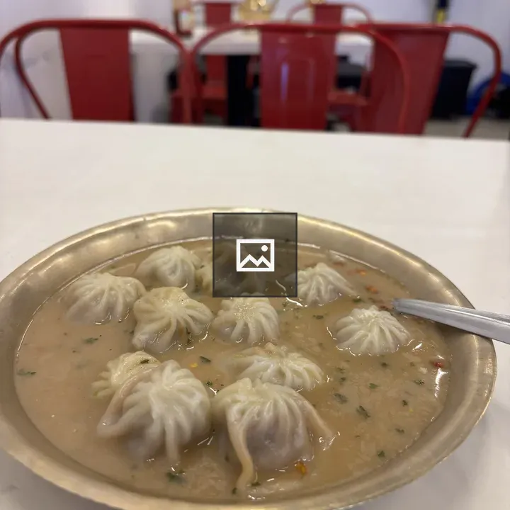 Bowl of dumplings in broth