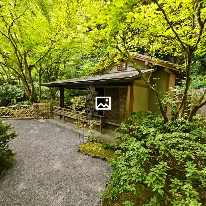 Tea house among trees and gravel paths