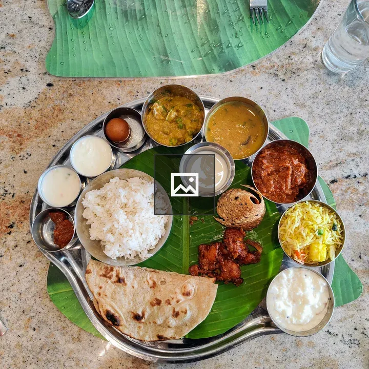 Stainless steel thali on banana leaf