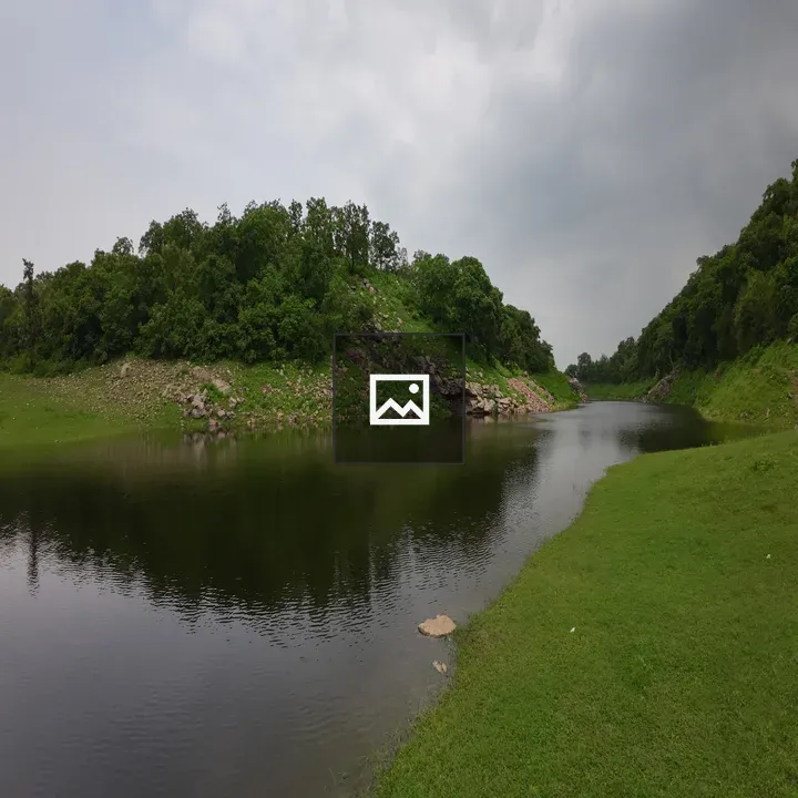Small lake with tree-covered hills