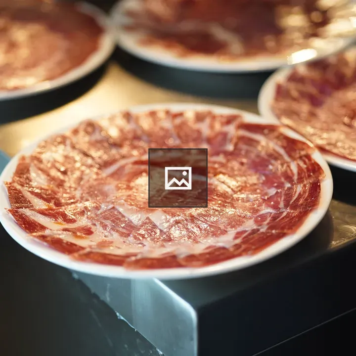 Iberico ham on a white plate