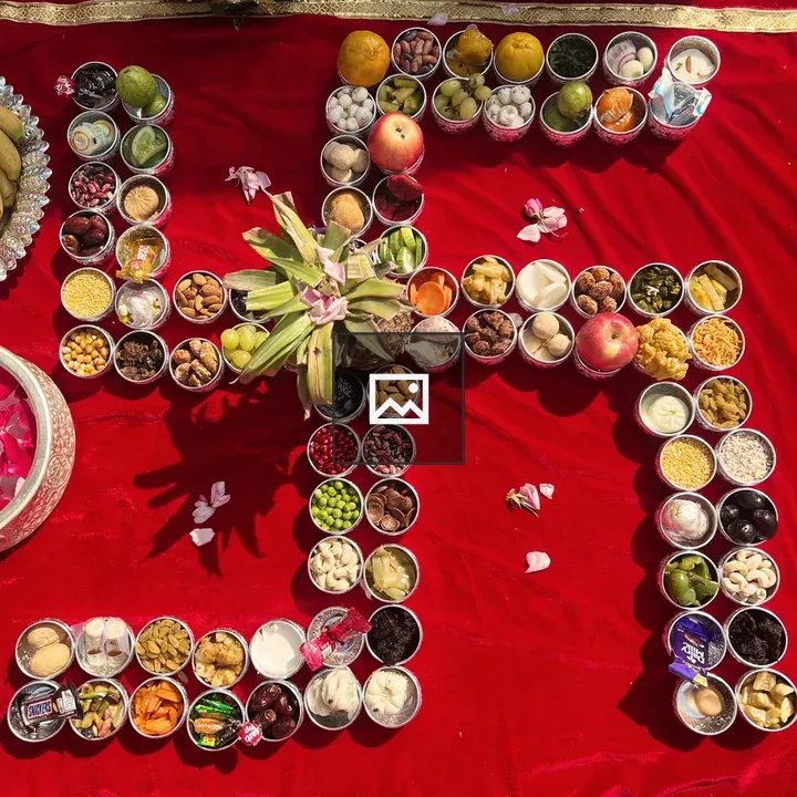 Swastika-shaped bowls with fruits and grains