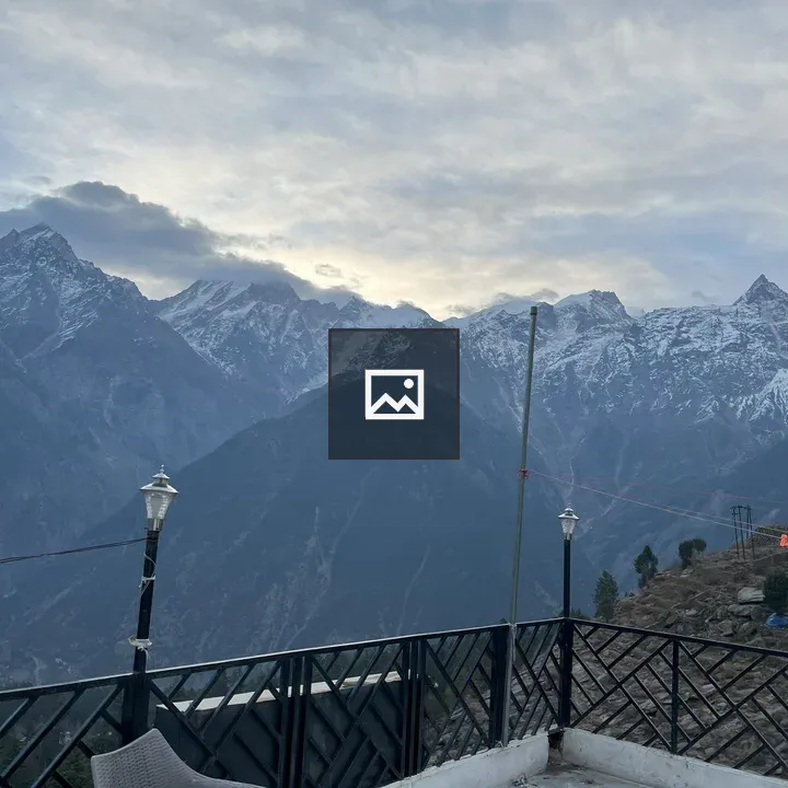 Panoramic Mountain View with Huts and Lantern