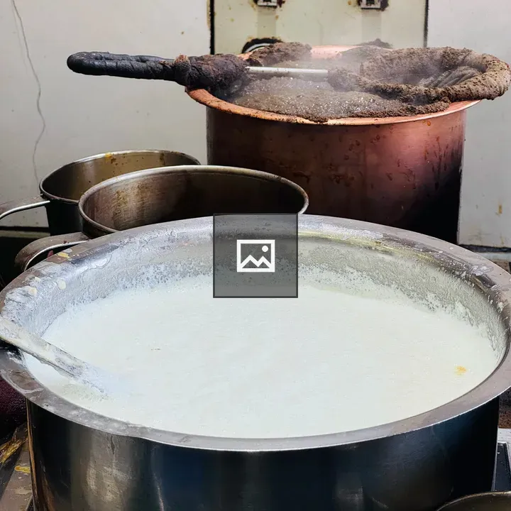 Pot of Steaming Milk and Tea Pot