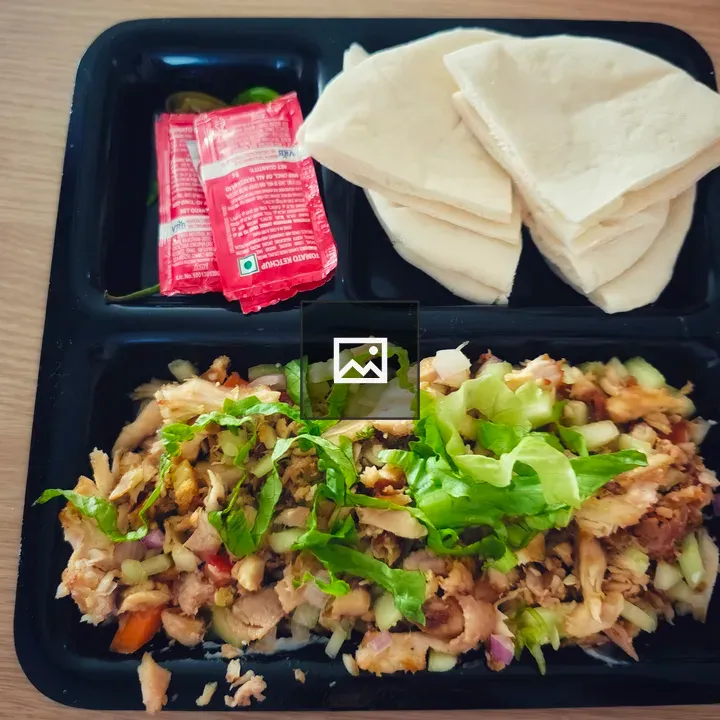 Chopped chicken shawarma on tray