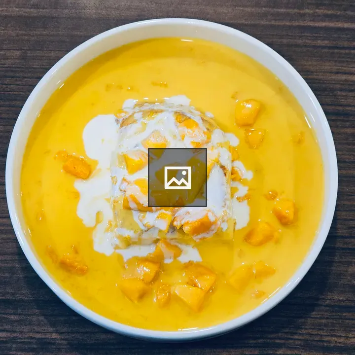 Mango dessert in white bowl