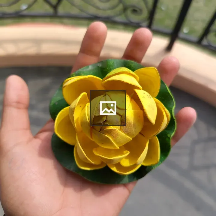 Hand Holding Decorative Flower