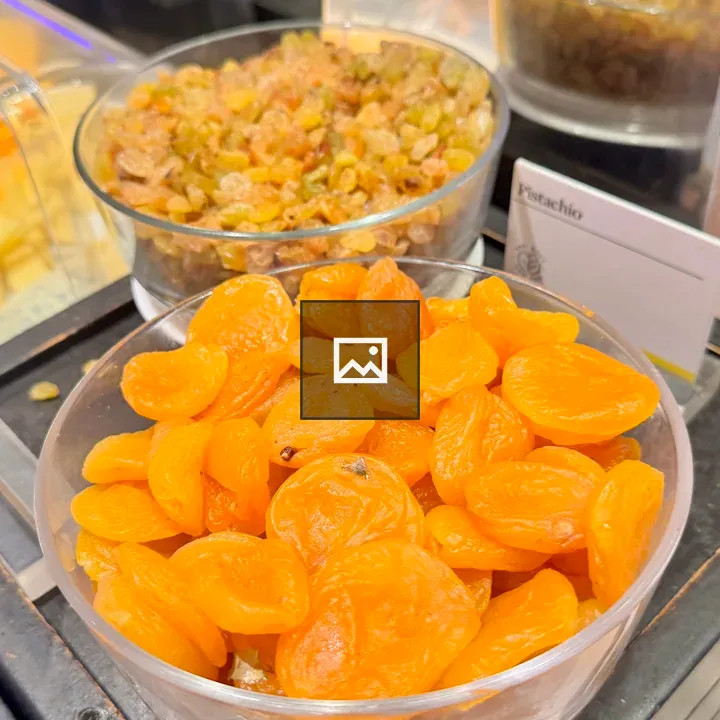 Glass bowl with dried apricots