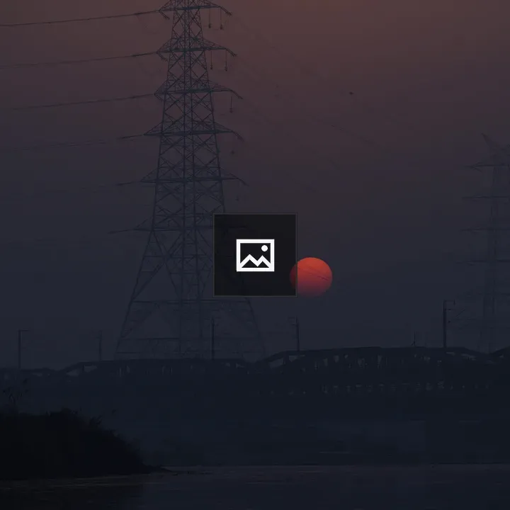 Sunrise between electricity poles