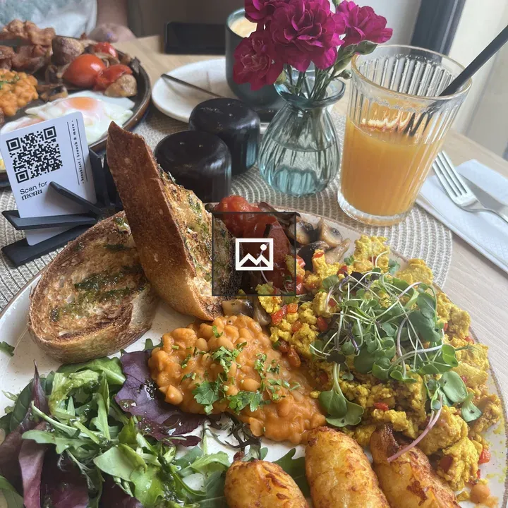 Brunch plate with greens and fried potatoes