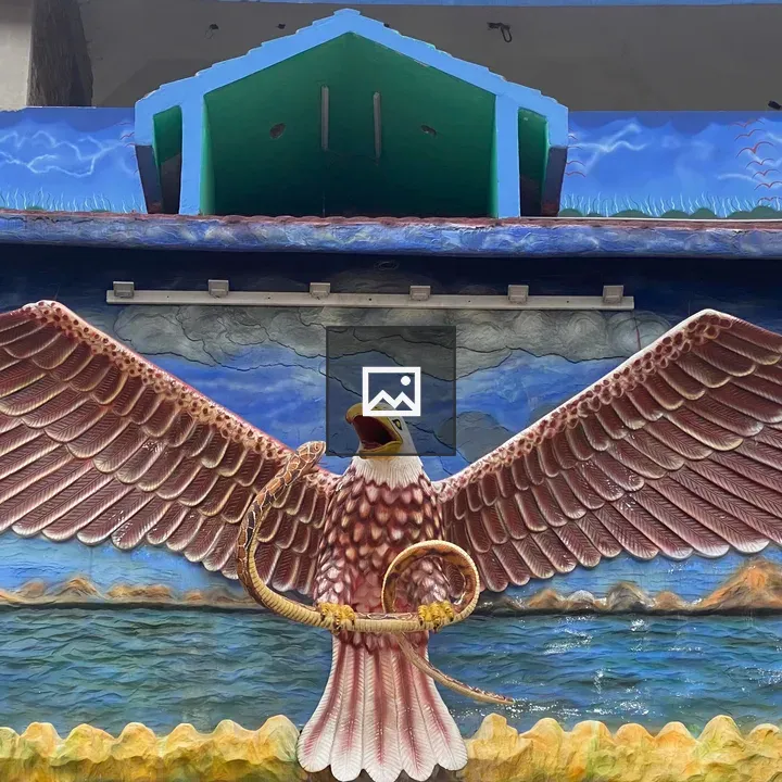 Colorful eagle sculpture with snake