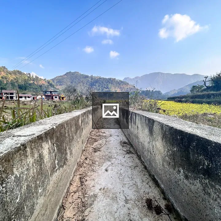Empty canal with distant bazaar