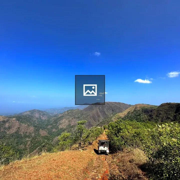 Scenic mountain road with jeep