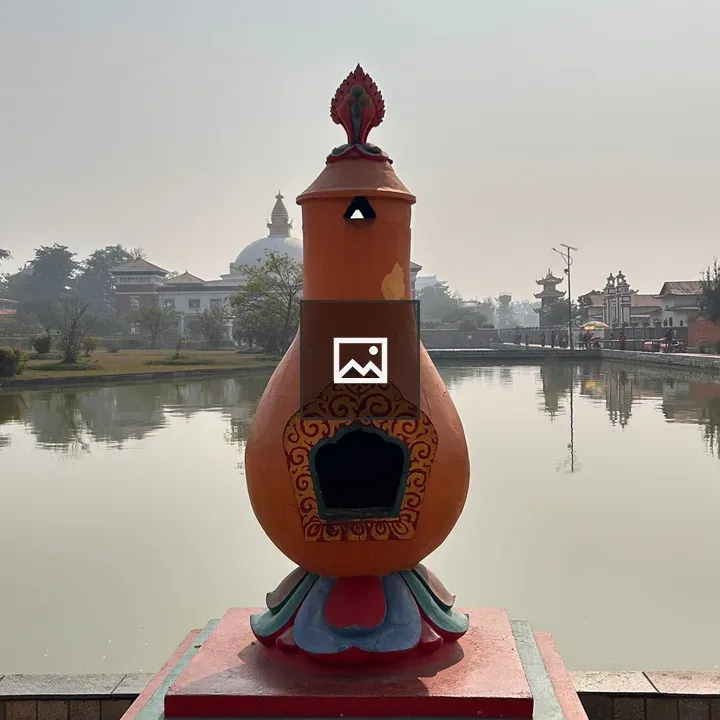 Colorful ornamental gourd by water