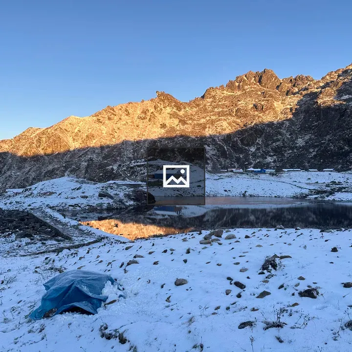 Snow-covered hill at sunrise