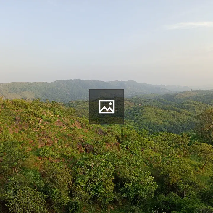 Green mountain with blue sky