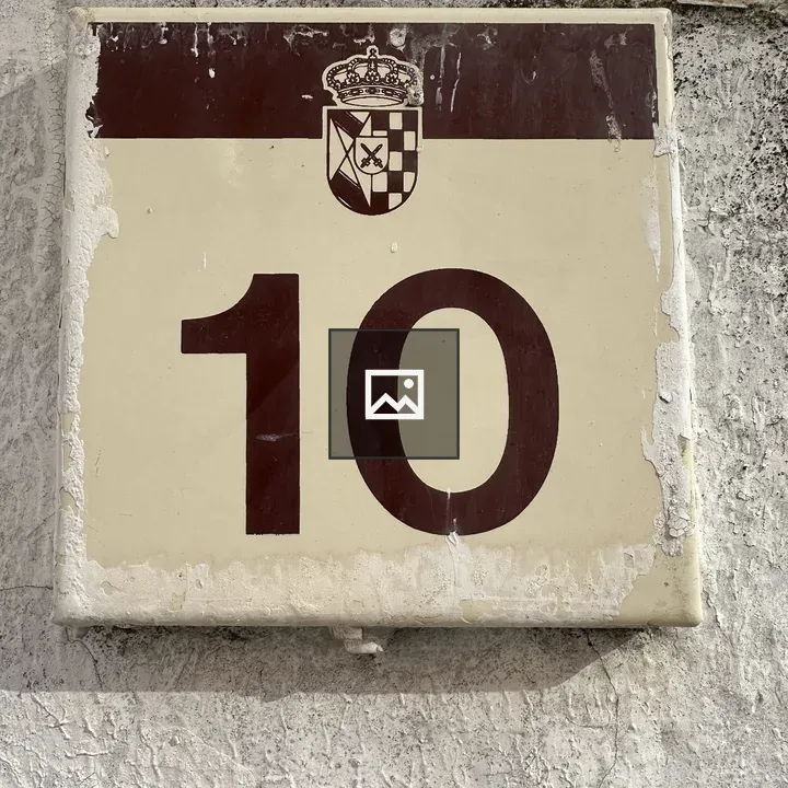 Sign with number 10 on wall
