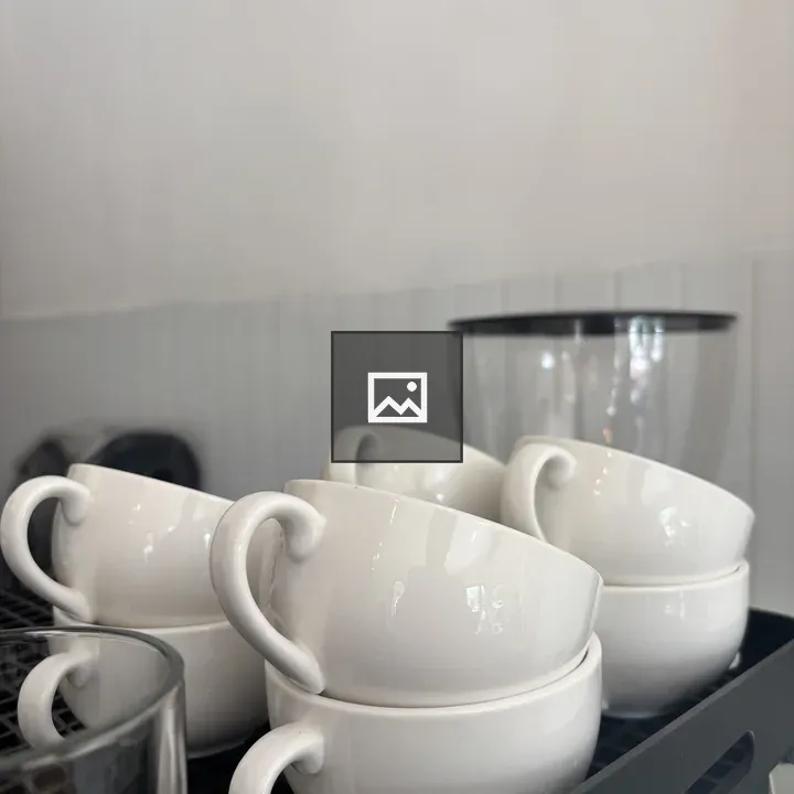 Stack of Ceramic Cups on Tray