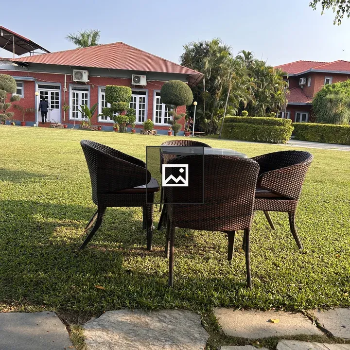 Three Wicker Chairs Outdoors
