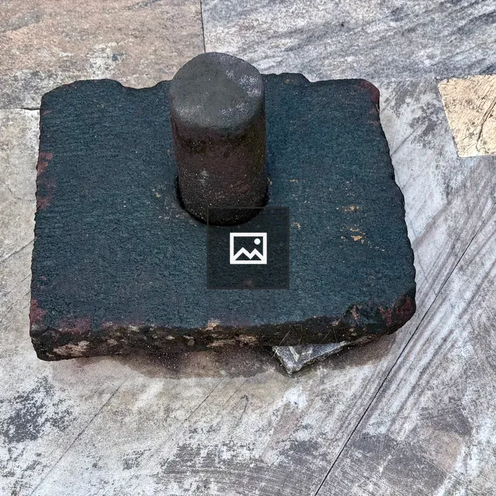 Ancient Shiva Linga on Stone Floor