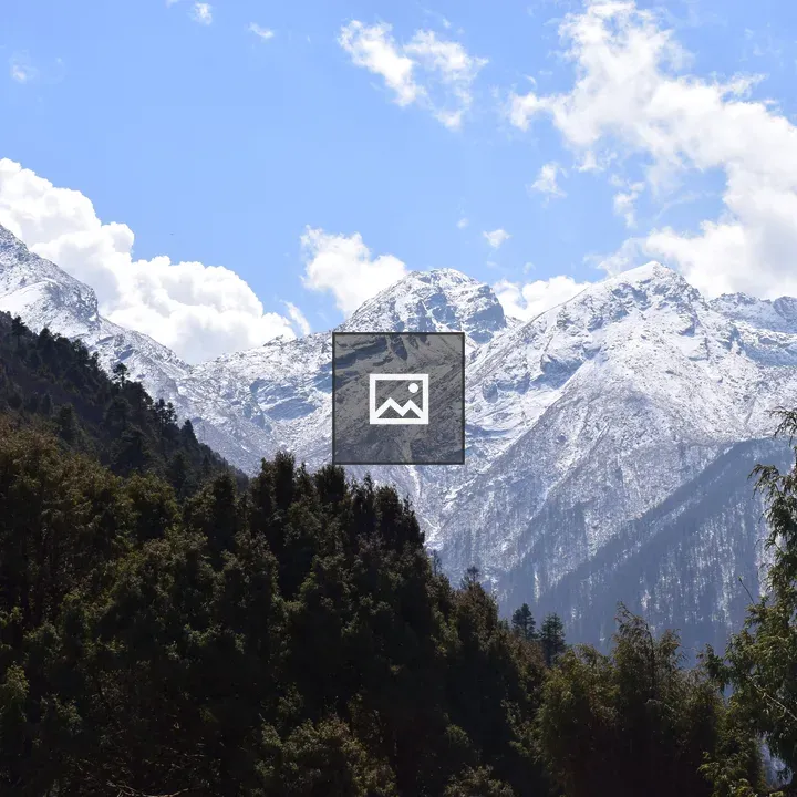Snowy mountain peaks against blue sky