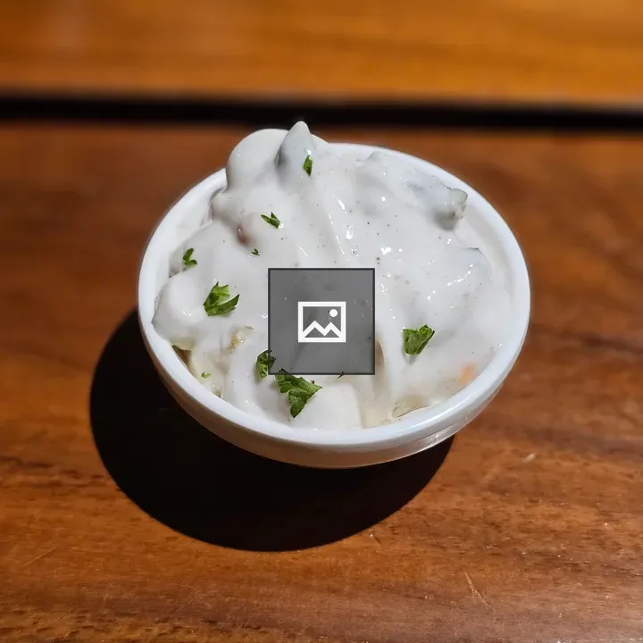 Creamy white dip in small bowl