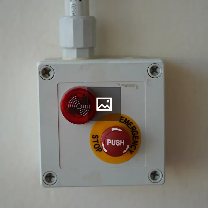 Emergency stop button on wall