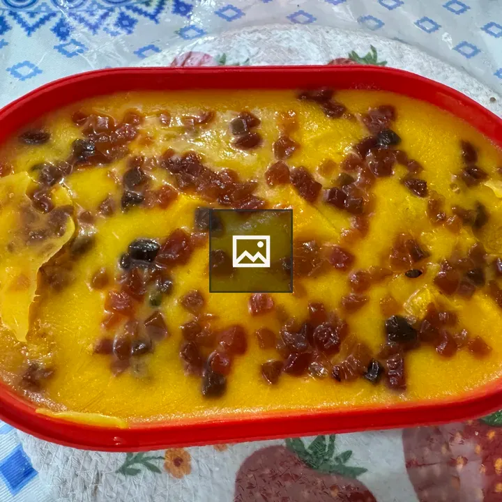 Mango ice cream tub with dried fruit
