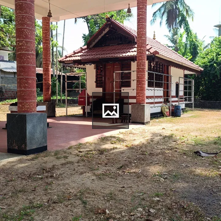 Small temple-like building with red roof