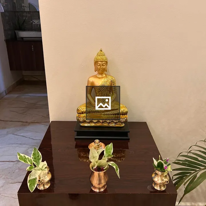 Buddha statue on wooden table