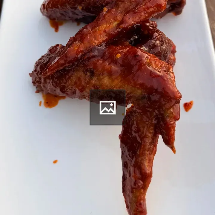 Plate of glazed chicken wings