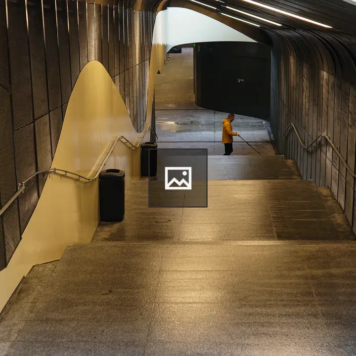 Maintenance worker on long stairs