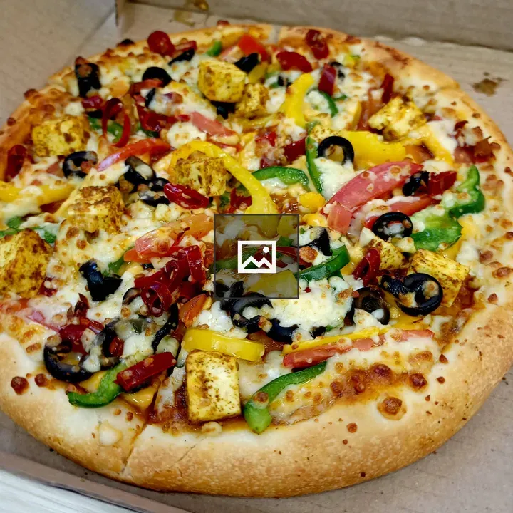 Loaded vegetarian pizza close-up