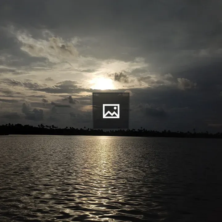 Lake scene with sunrays and clouds